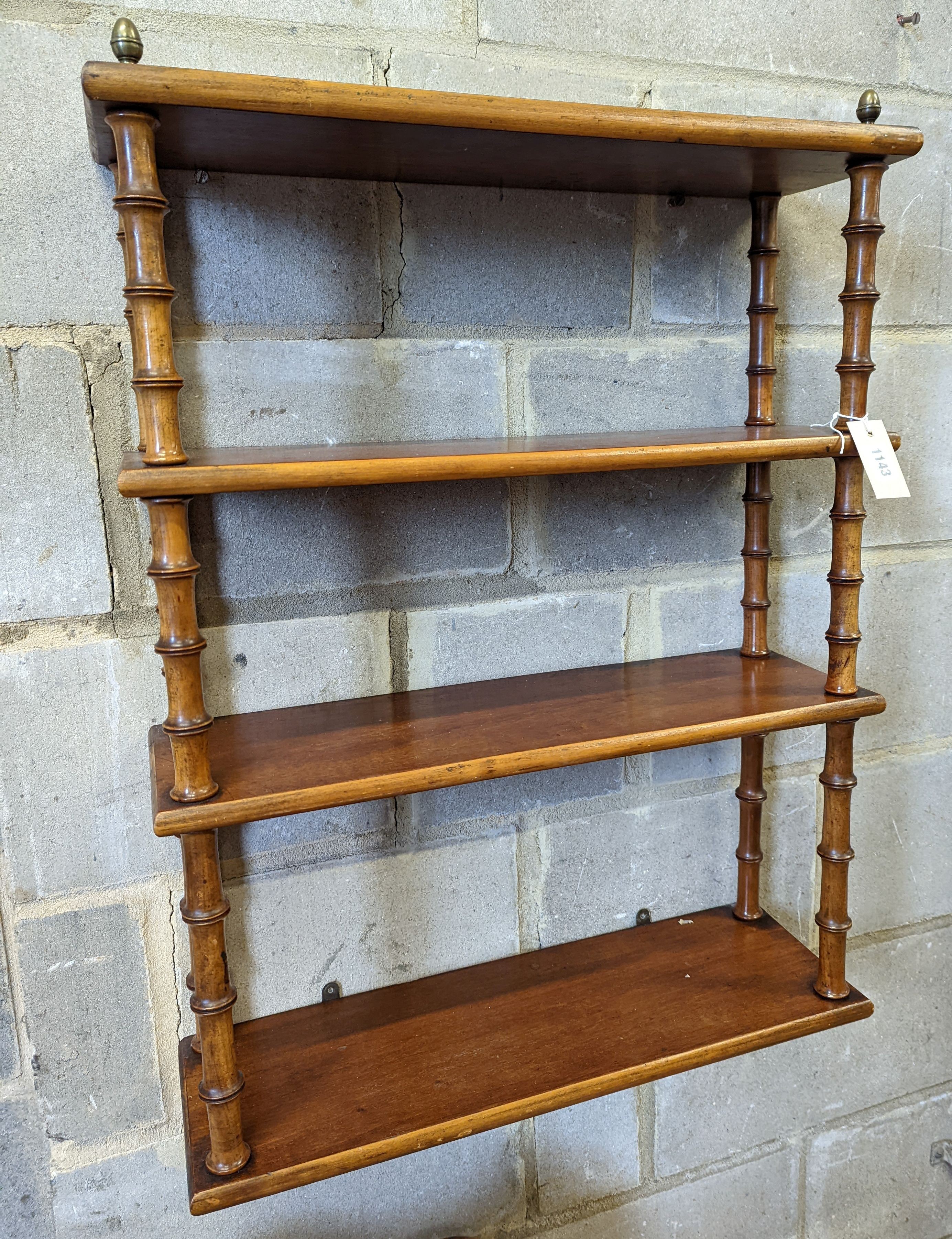 A Regency style mahogany four tier wall bracket, width 60cm, depth 19cm, height 80cm